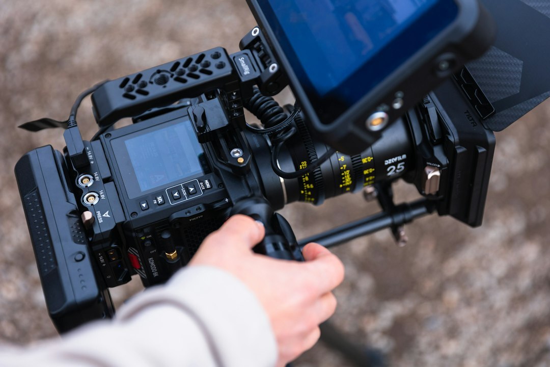 Camera operator adjusting a broadcast camera during a live show