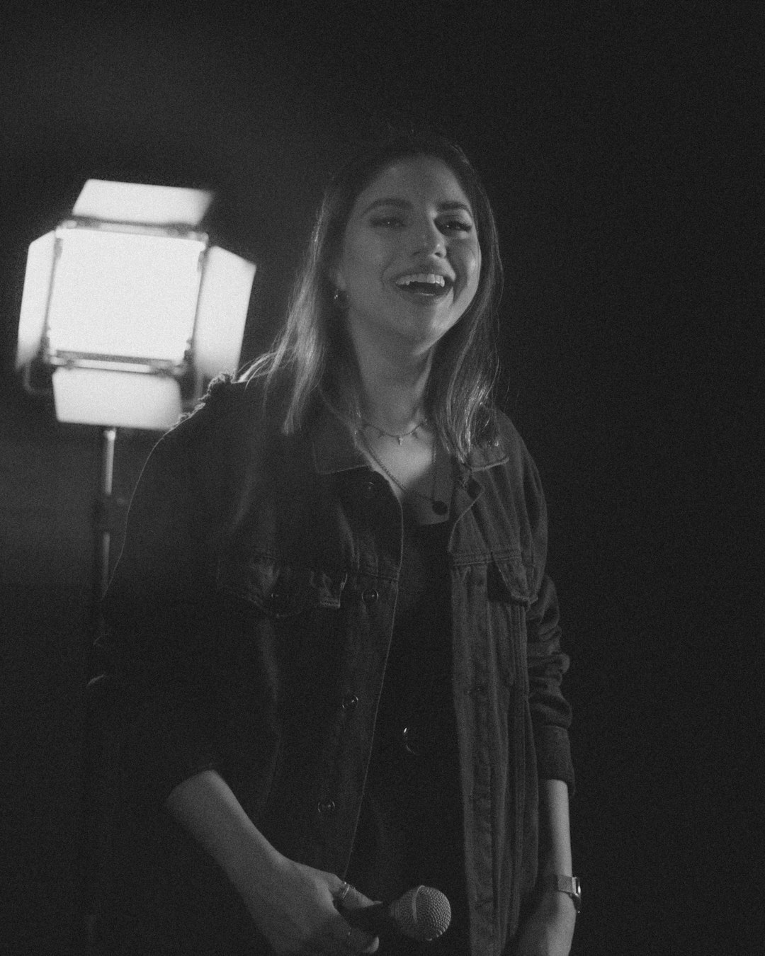 Portrait of a female lighting director smiling at the camera